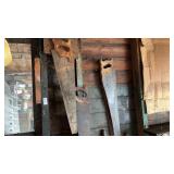 Hand Saws and Drain Snake on Wall