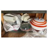 Assortment of kitchen storage items and ceramic