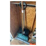 2 snow shovels and cleaning brush