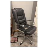 Metal office chair on wheels with leather seat
