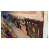 Lot of Framed Art Along Wall