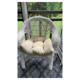Vintage white wicker armchair with cushion and