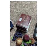 Lot of religious books and decorative fruit