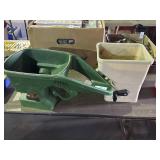 Two Gardner Handheld Spreaders