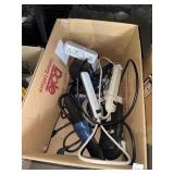 Box of Surge Protectors and Extension Cords