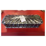 This rectangular ceramic trinket tray is made in