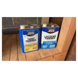 2 containers of paint thinner opened