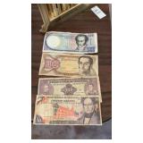 Vintage Venezuelan Bolivares banknotes featuring