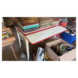 Vintage enamel top table featuring retractable