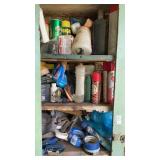 Assorted fluids, tape, etc. in cabinet