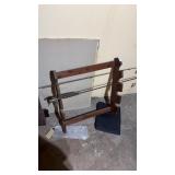 Freestanding wooden fishing rod rack with rods