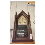 Antique mahogany steeple clock labeled Barnums