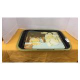 Vintage metal serving tray features Norman