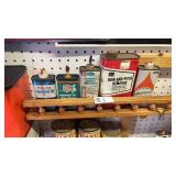 Lot of small oil tins