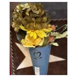 Hanging metal wall pocket with flowers