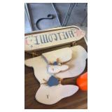 Wooden welcome Easter sign and orange candle