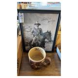Framed reprint of John Wayne in 1970 with
