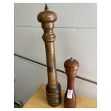 2 wooden pepper mills