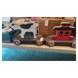 Vintage wooden folk art pull toy of barn and cow
