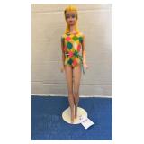 Vintage Mattel Barbie in iconic swimsuit with a
