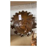 Hand-carved wooden celestial sun, moon, and stars