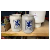 Assorted beer steins and canister