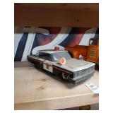 Vintage tin Ford motorized police car 12" long