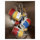 Royal Norfolk primary color mugs on metal rack