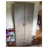 Storage cabinet 71 in by 29 in by 17 in *contents