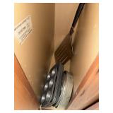 Lot of assorted baking pans and pizza spatula