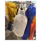 Foldable clothing rack with assorted rain jackets