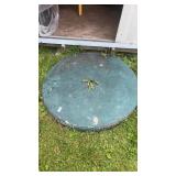 Cement Table and Base Located By Each Shed