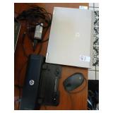HP EliteBook 8440P laptop, charger, and docking