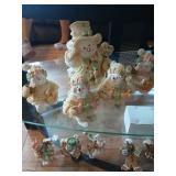 2 shelves of snowmen, gingerbread, and Christmas
