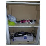Contents of bath cabinet curling irons, etc.