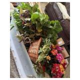 Bin of floral decor and picture frames