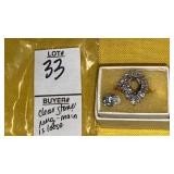 Clear stone ring - center stone is loose, mark is