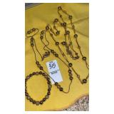 (2) Aigner gold bead necklaces, bracelet