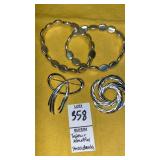 Trifari & Monet silvertone pin brooches, stretch