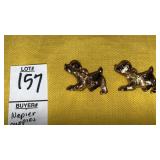 Napier Goldtone puppies pins w/ red gem eyes