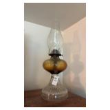 Antique kerosene oil lamp with amber glass front
