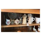 Shelf lot - milk glass teacups, angel figurines,