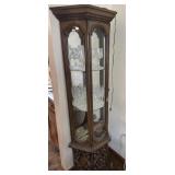 Glass lighted half hex curio cabinet with ornate