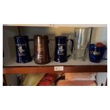 Shelf of various drinking mugs
