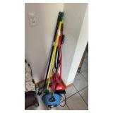 Lot of various brooms and cleaning items