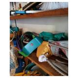 Shelf lot of sprinklers, ice scrapers and misc