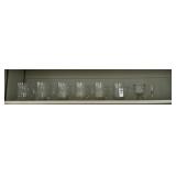 Shelf lot of glass mugs and misc
