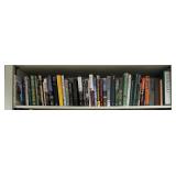 Shelf lot of golf novels/guides and misc