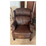 Traditional dark brown leather wingback armchair