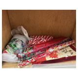Shelf lot of Christmas wrapping supplies